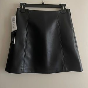 Black vegan leather skirt from Aritzia.